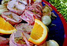 Orange-glazed apple-stuffed pork fillet with balsamic baby onions on the side